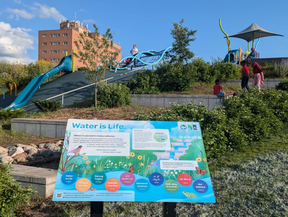 A large, colorful educational sign titled 